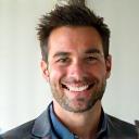 Professional headshot of a smiling man, David L.